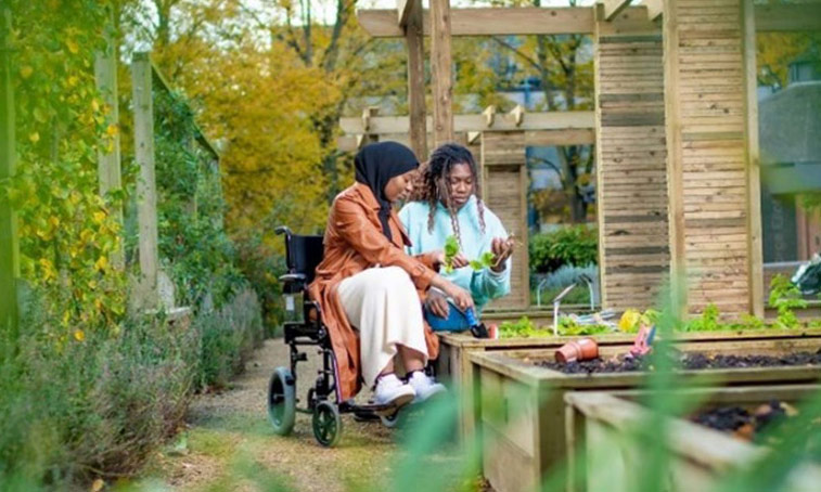two students in a university garden