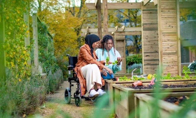 two students in a university garden