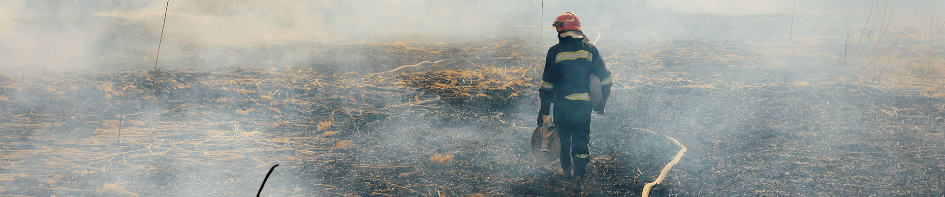 fireman on a scorched field