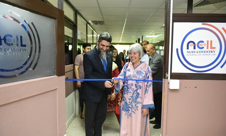 Two academics cutting the ribbon at the launch