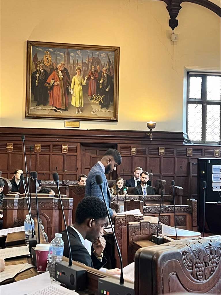 Gethushan standing up in the moot room at the Coventry University mooting competition 2024