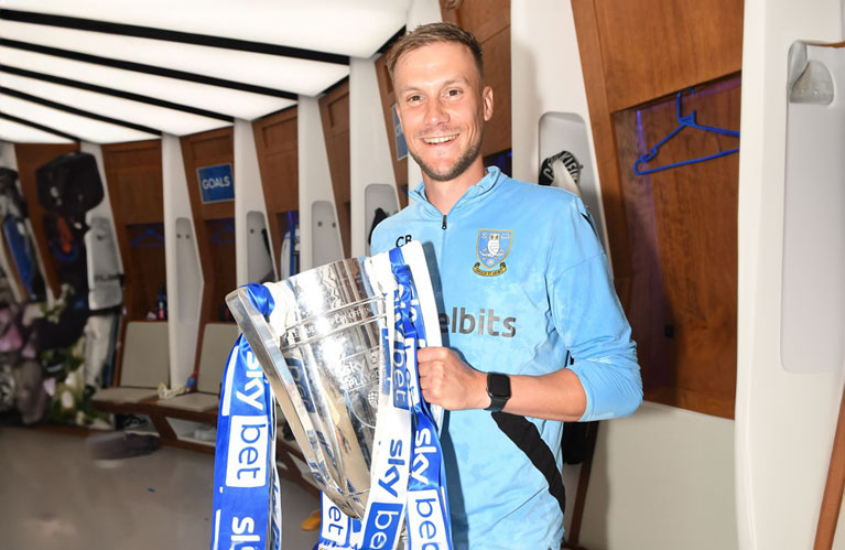 Chris Brealey holding EFL League One play-off cup