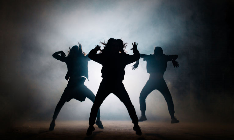 Group of young hip-hop dancers performing on the stage. effective performance. beautiful dance. full of energe dancers