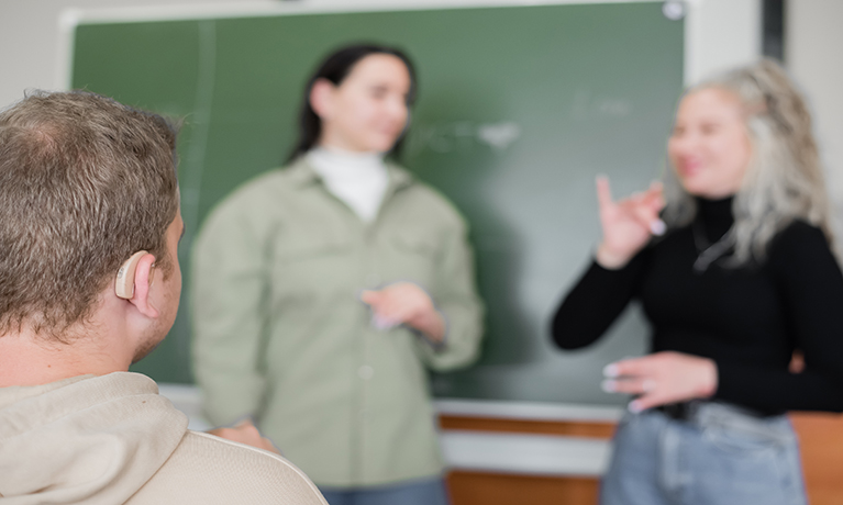 Deaf students learning in a classroom