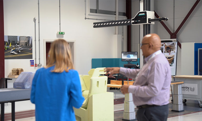 Man and woman working in a workshop