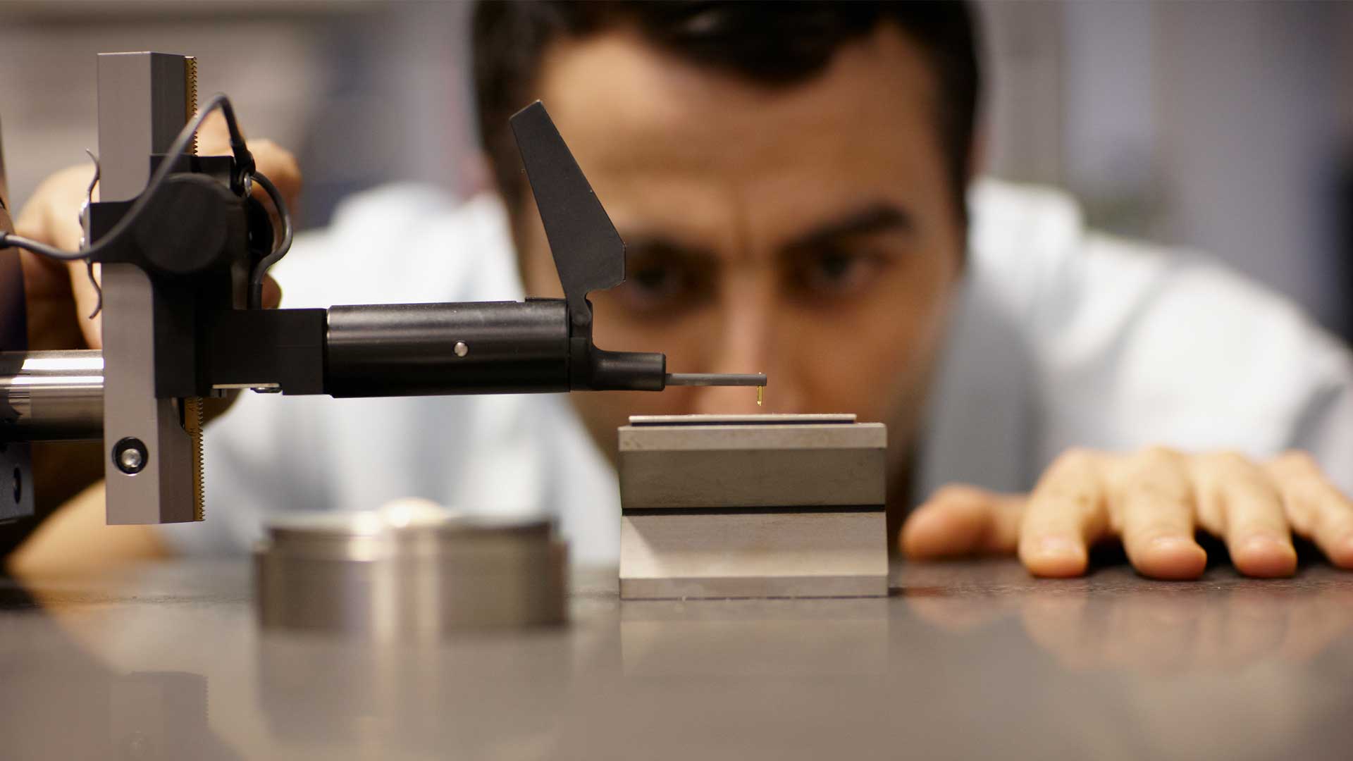 Close up of student using metrology tools