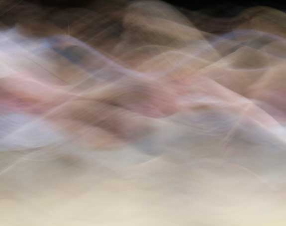 an image of colourful smoky patterns representing movement such as dance