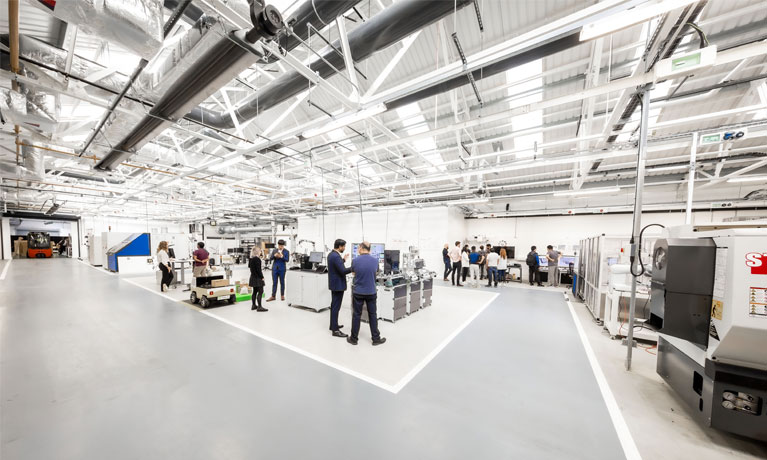 People stood in a modern new building.