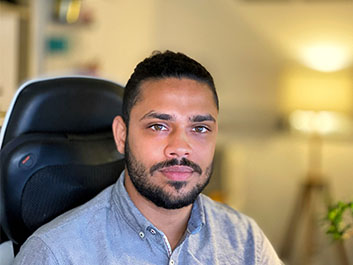 Hyder Khan sitting at a desk