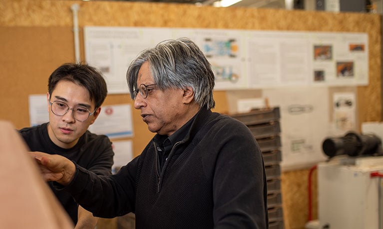 Student and lecturer working in studio