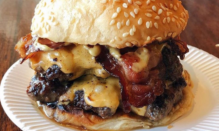 close up of burger on a plate