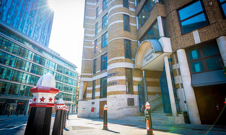 Shot of London street with campus sign on right