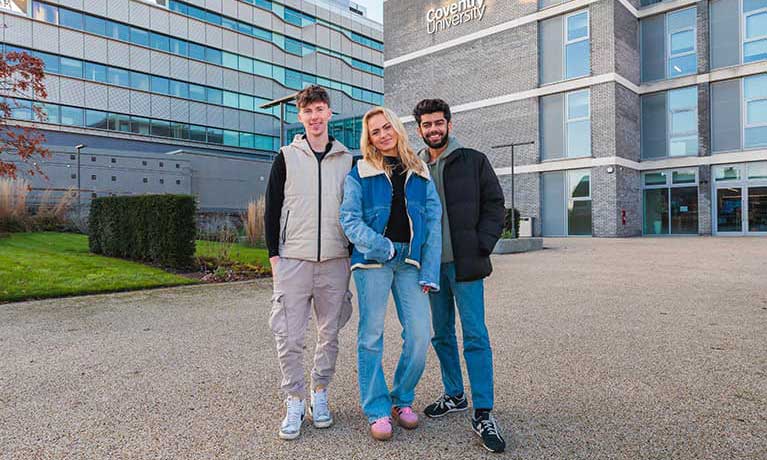 Student with her parents walking through the campus
