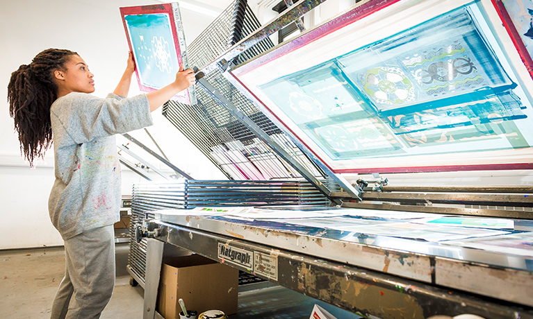 A student working in a printing studio