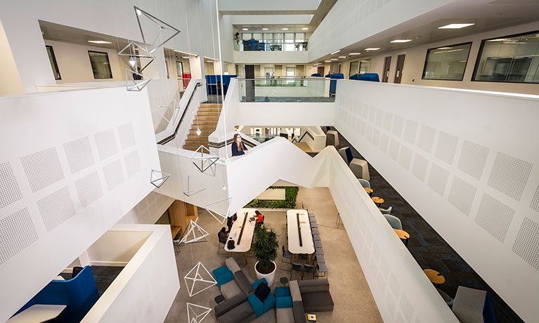 Aerial view of an open space with stairways and desks