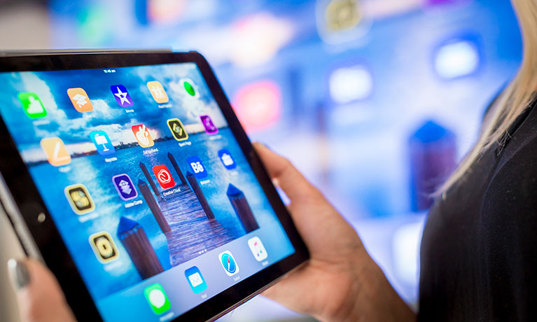 Close up shot of an tablet screen being held by a student