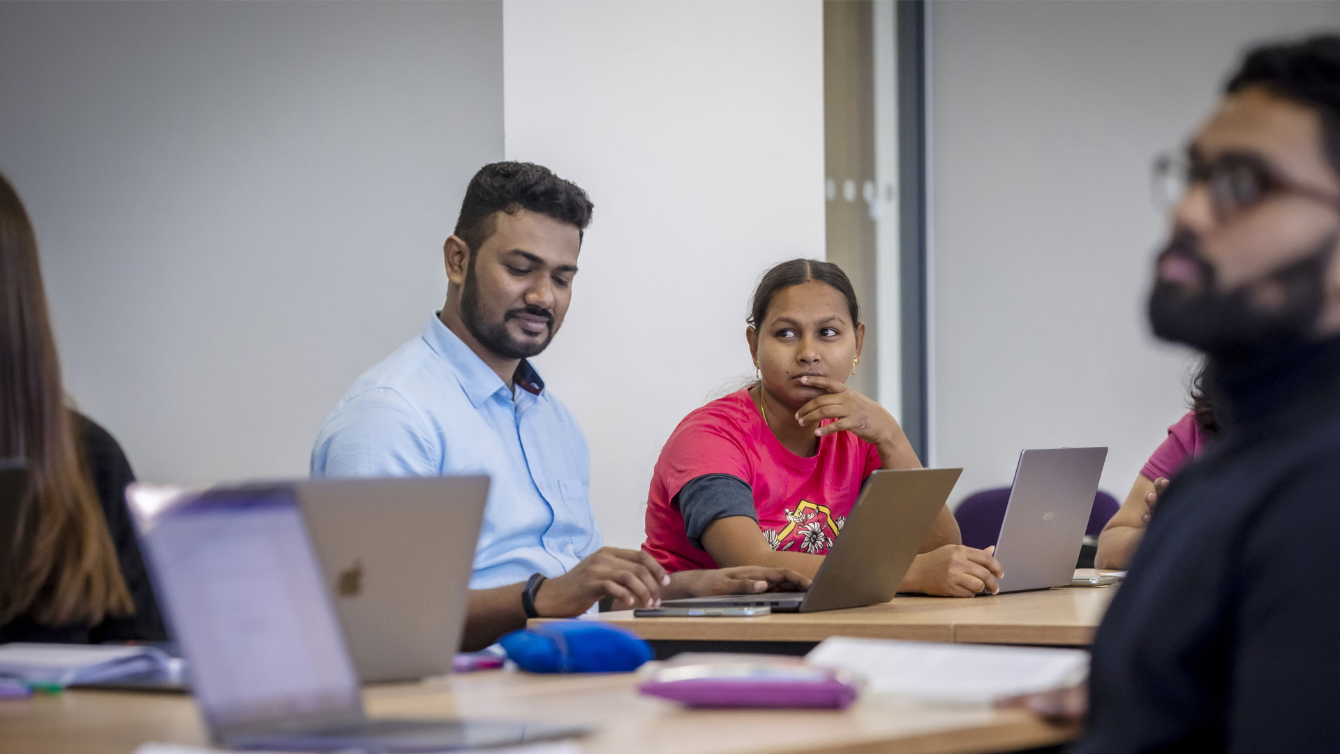 Students in a classroom working on laptops