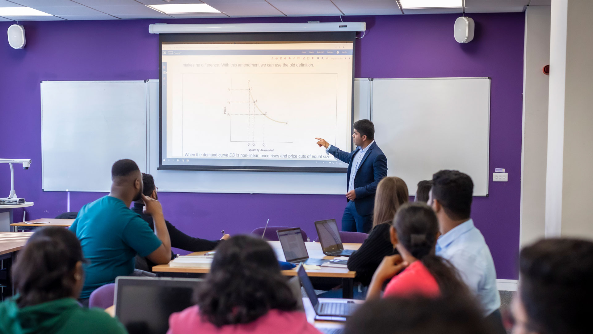 Students watching a lecturer presenting