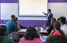 Students watching a lecturer presenting