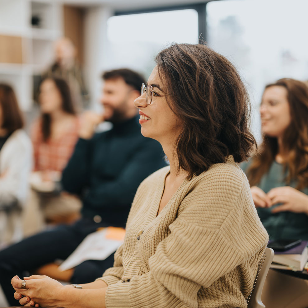 professional woman in a CPD class with other professionals