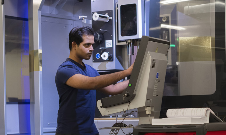 Student using engineering machinery