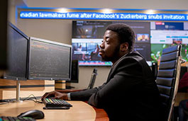 Student using dual computer monitors