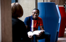 Group of people having a conversation at a table 