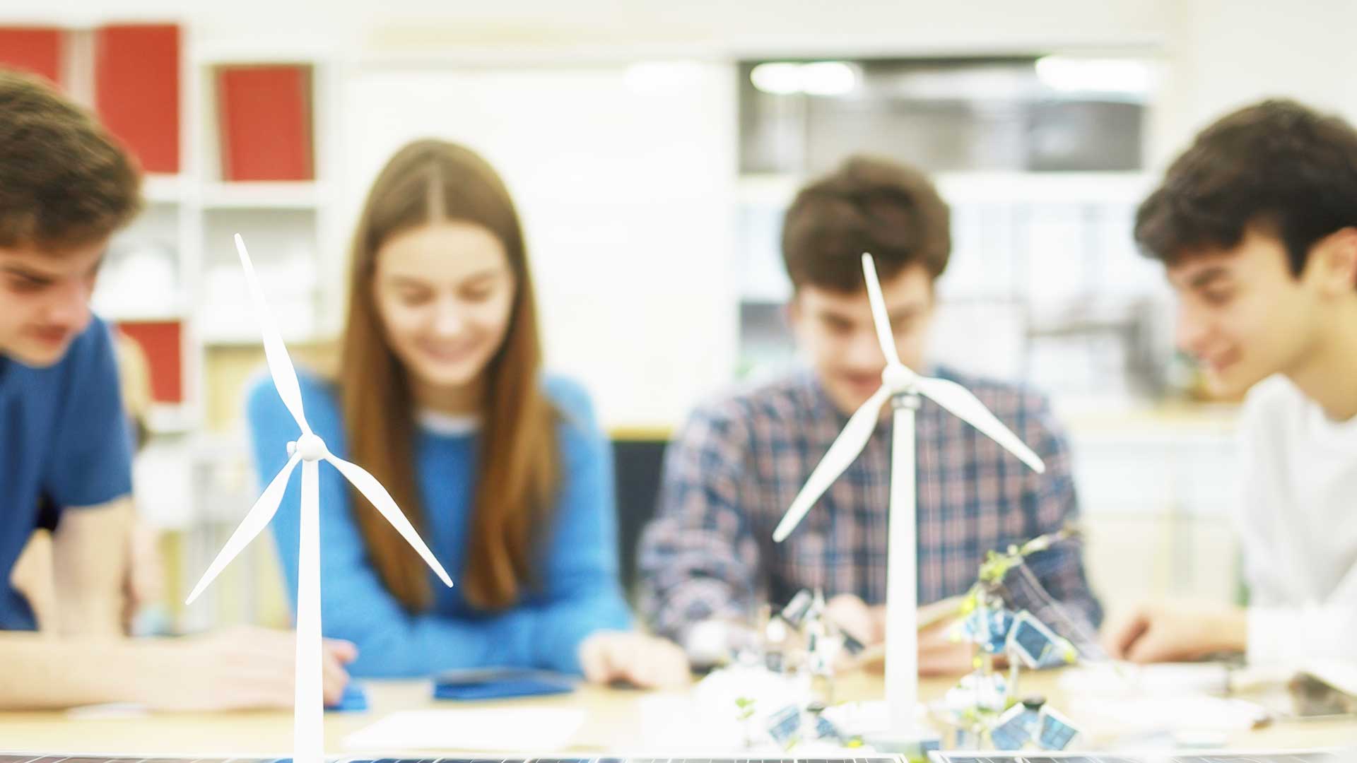 Students working on a design of a windfarm