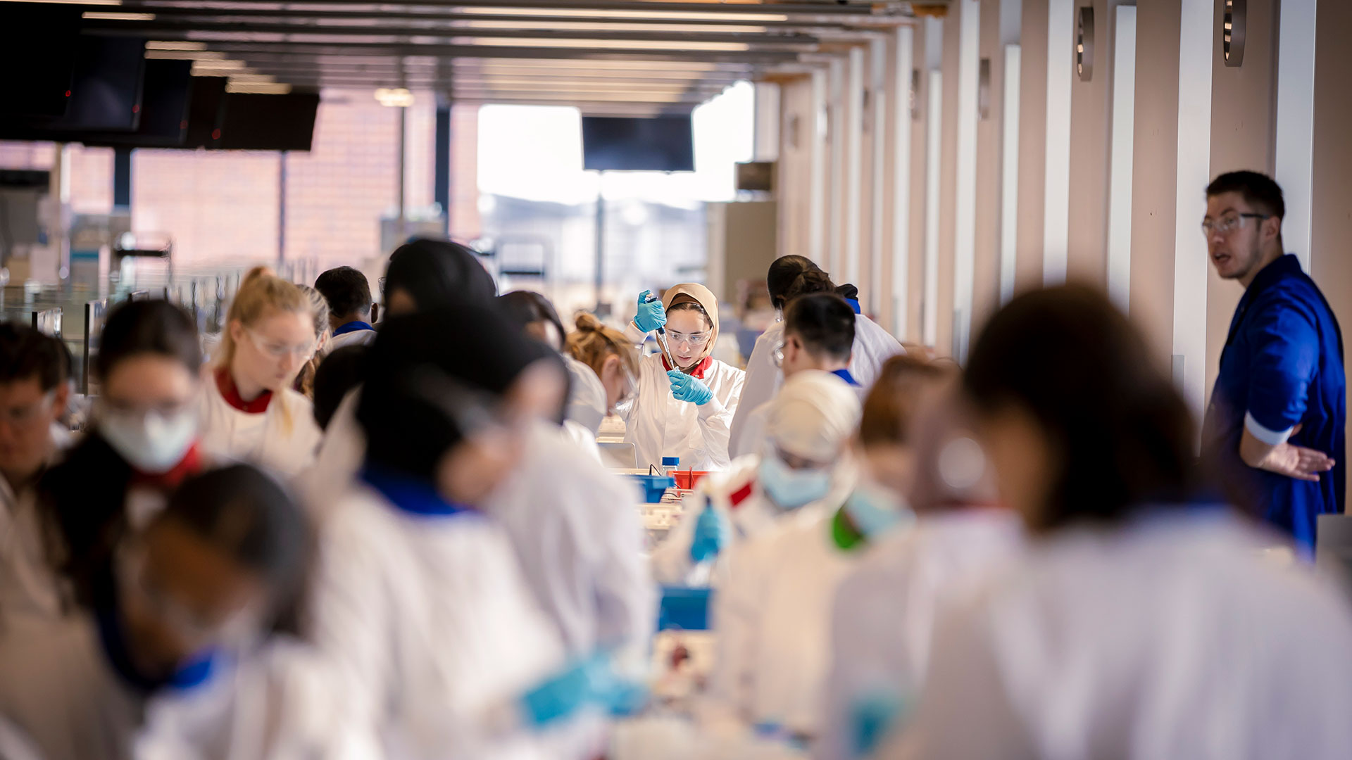 Three students working together in the Super Lab