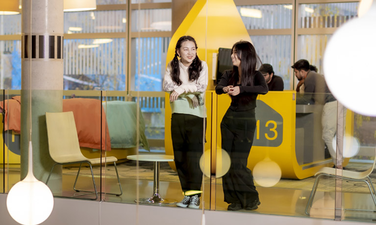 Two international students in The Hub.