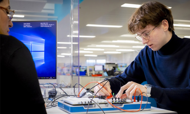 A student using electronics