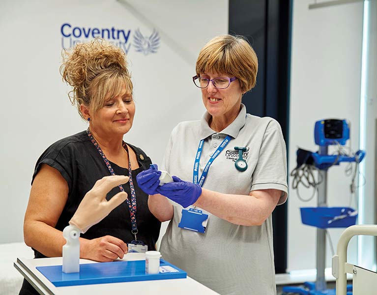 Clinical lead demonstrating a glucometer device