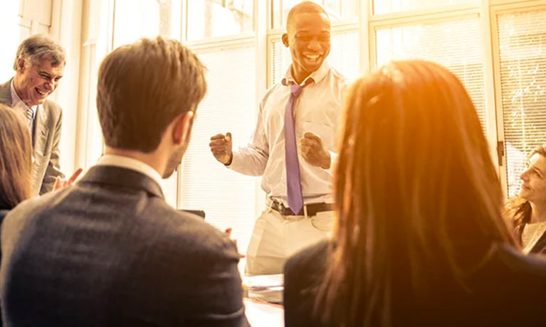 People celebrating in a business meeting