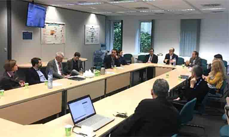 People sitting around table in conference room