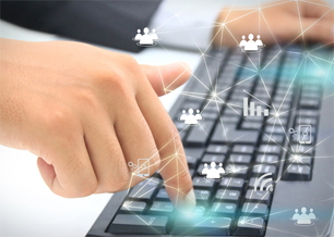 Close up of fingers typing on a computer keyboard