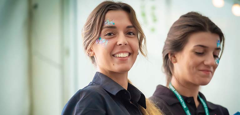 2 smiling female students 