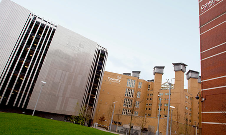 car park building with grass in front