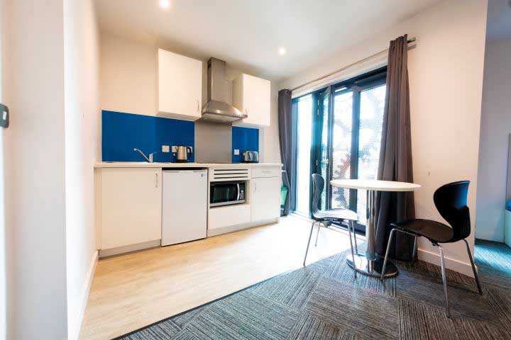 Kitchen and dining table and chair in Godiva Place Studio