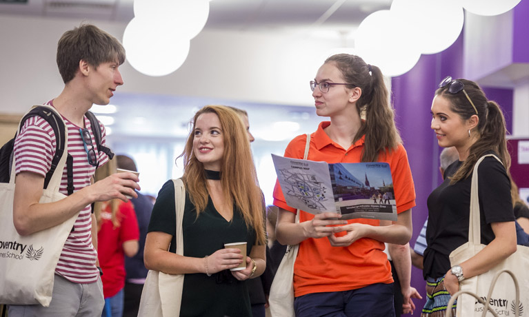 students taking together in the student hub