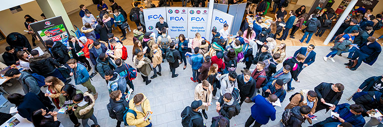 students milling around at a careers fair