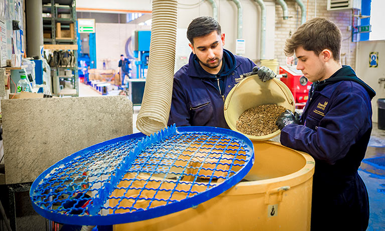 Student working with materials in lab