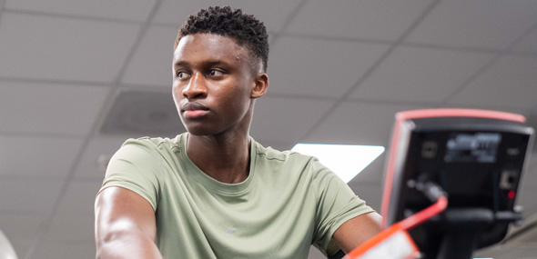 student on a gym bike