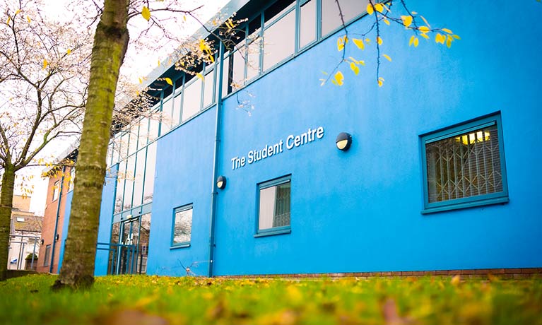 External view of The Student Centre with autumn leaves