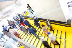 people walking down some stairs