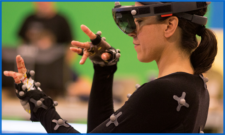 Brunette lady wearing a VR headset against a green wall