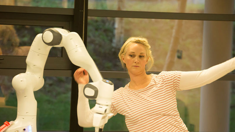 Woman dancing with a robot