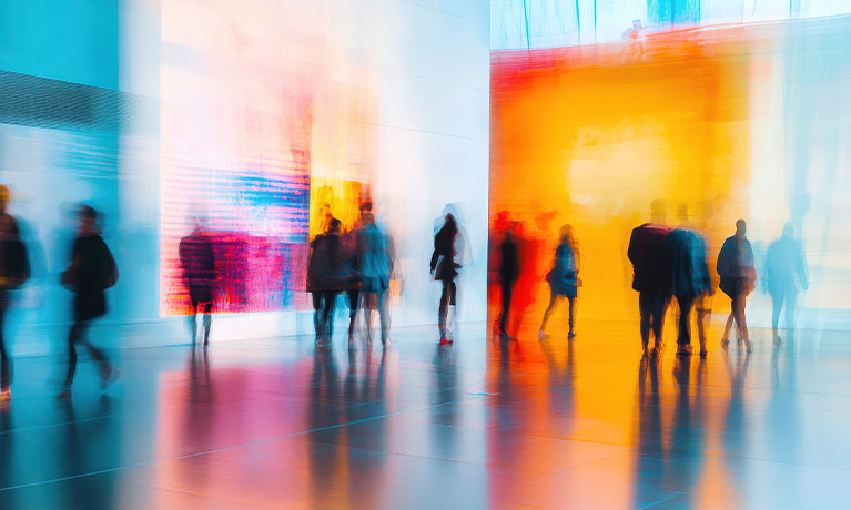 Blurred people in an art gallery