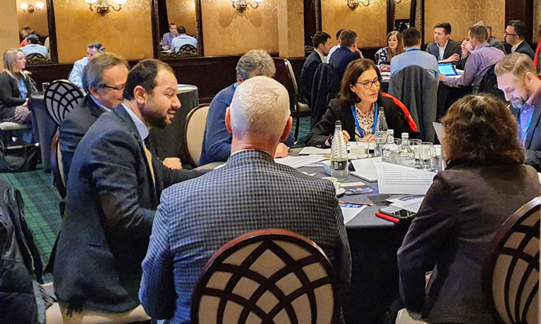 Delegates at the event sat around table.