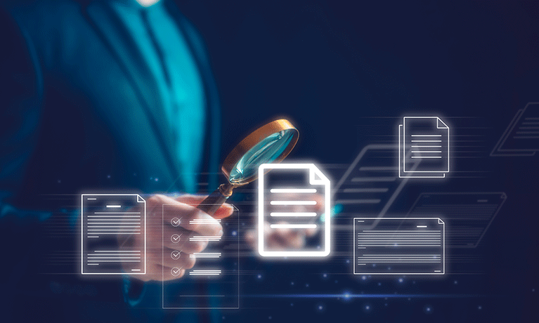 businessman hand holding magnifying glass looking at virtual document icons to represent tax fraud