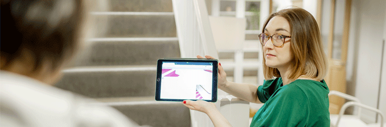 Woman holding a tablet device